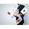 Close up of businessman throwing cards. Gambling concept