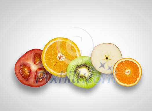 Halves of juicy fruits against white background