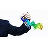 Businessman against white background drawing colorful splashes with marker
