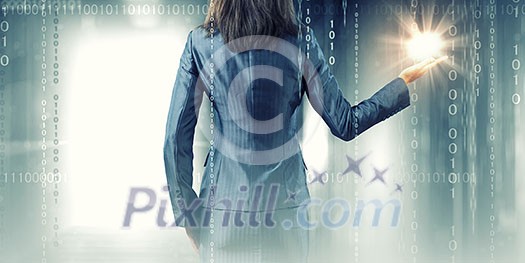 Back view of businesswoman holding earth planet in hand