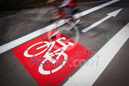 Urban traffic concept - bike/cycling lane sign in a city Urban traffic concept - bike/cycling lane sign in a city