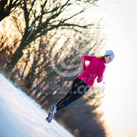 Young woman running outdoors on a cold winter day Young woman running outdoors on a cold winter day