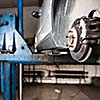 Inside a garage - changing wheels/tires (shallow DOF; color toned image)