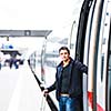Train travel - Handsome young man taking a train