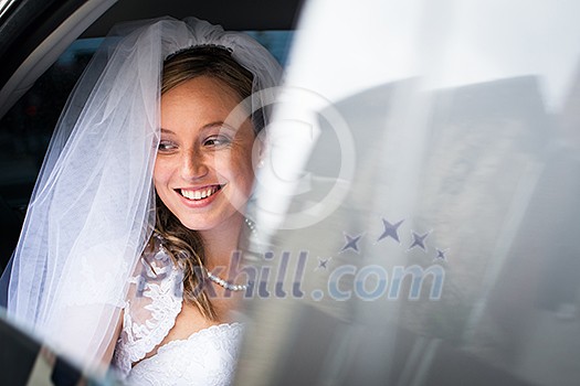 Portrait of a beautiful young bride waiting in the car on her way to the wedding ceremony Portrait of a beautiful young bride waiting in the car on her way to the wedding ceremony