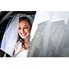 Portrait of a beautiful young bride waiting in the car on her way to the wedding ceremony