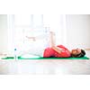 Pretty young woman doing YOGA exercise at home