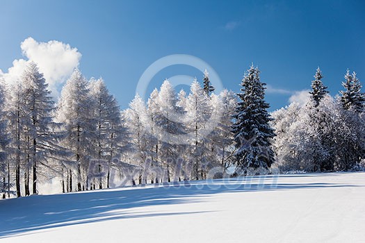 Snowy mountain scenery with deep blue sky