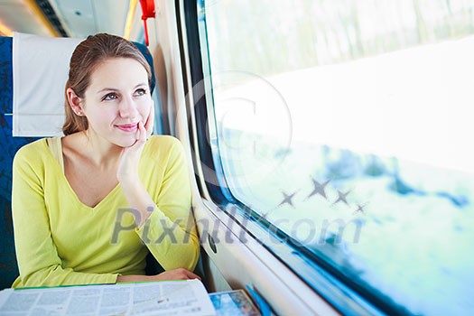 Young woman traveling by train