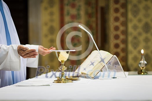 Priest during a wedding ceremony/nuptial mass Priest during a wedding ceremony/nuptial mass
