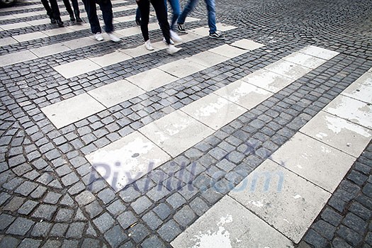 urban traffic concept - city street with a motion blurred crowd crossing a road urban traffic concept - city street with a motion blurred crowd crossing a road