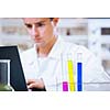 close-up portrait of a young male researcher carrying out experiments in a chemistry research lab (color toned image)