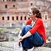 Portrait of a pretty, young, female tourist in Rome, Italy (with Colosseum in the background)
