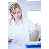 portrait of a female researcher doing research in a lab (color toned image; shallow DOF)