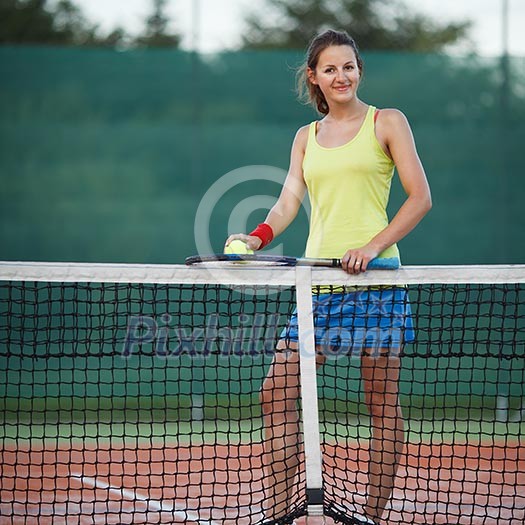pretty, young female tennis player on the tennis court (shallow DOF, selective focus) pretty, young female tennis player on the tennis court (shallow DOF, selective focus)
