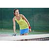 pretty, young female tennis player on the tennis court (shallow DOF, selective focus)