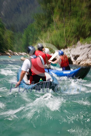 white water rafting (motion blur is used to convey rapid flow of the river/movement of the raft boat)