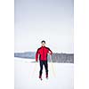 Cross-country skiing: young man cross-country skiing on a lovely snowy winter day