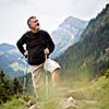 Active senior hiking in high mountains (Swiss Alps)