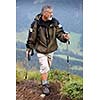 Active senior hiking in high mountains (Swiss Alps)