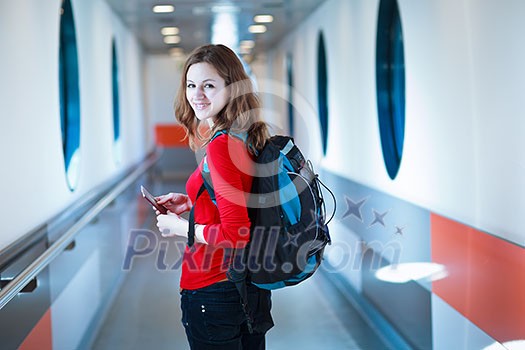 Portrait of a young woman in the boarding bridge, boarding an aircraft Portrait of a young woman in the boarding bridge, boarding an aircraft