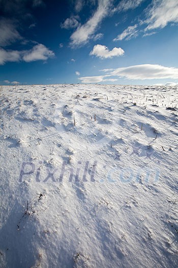 Snowy mountain scenery with deep blue sky