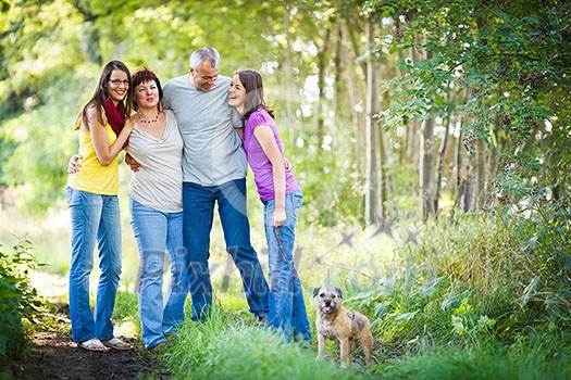 Family portrait - Family of four with a cute dog outdoors