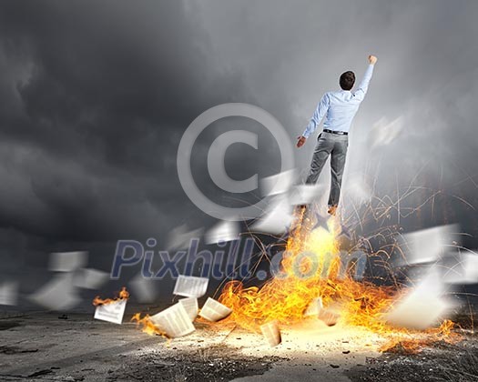 Rear view of businessman superhero flying up in sky Rear view of businessman superhero flying up in sky