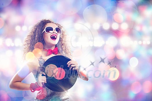 Young pretty girl dj at disco party holding vinyl