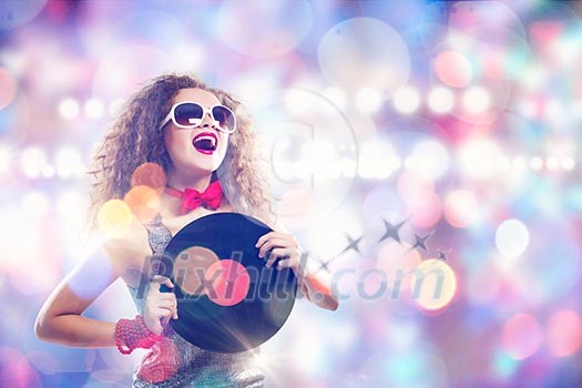 Young pretty girl dj at disco party holding vinyl Young pretty girl dj at disco party holding vinyl