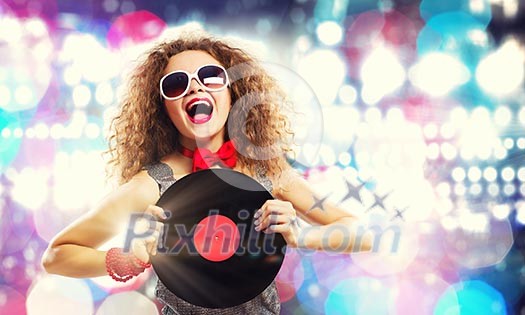 Young pretty girl dj at disco party holding vinyl Young pretty girl dj at disco party holding vinyl
