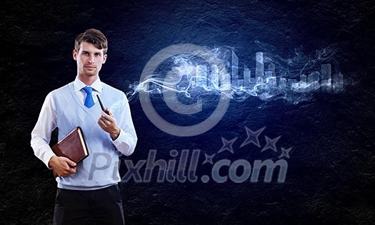 Young handsome businessman smoking pipe against black background Young handsome businessman smoking pipe against black background