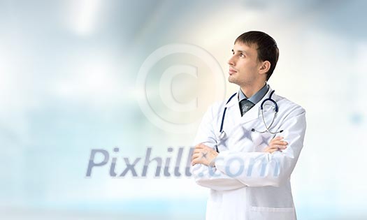 Young handsome doctor with stethoscope against white background Young handsome doctor with stethoscope against white background