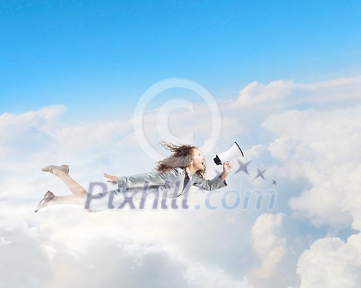 Young pretty businesswoman flying in blue sky