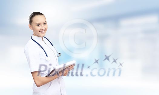 Young attractive woman doctor with stethoscope on neck
