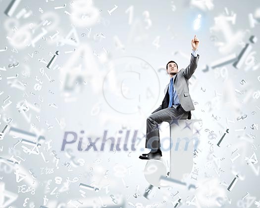 Young businessman sitting on huge white letter. Email concept