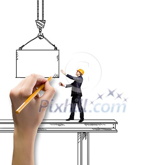 Businessman in helmet standing on construction beam Businessman in helmet standing on construction beam