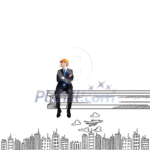 Businessman in helmet sitting on construction beam Businessman in helmet sitting on construction beam