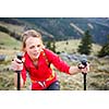 Pretty, young female hiker having a tough walk uphill