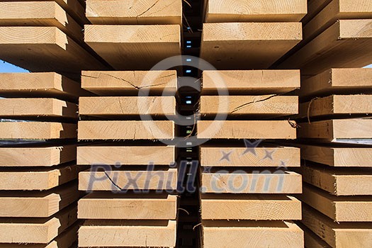 Stack of new wooden studs at the lumber yard Stack of new wooden studs at the lumber yard