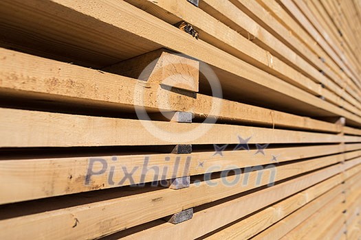 Stack of new wooden studs at the lumber yard Stack of new wooden studs at the lumber yard