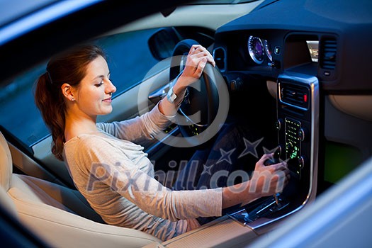 Pretty young woman driving her new car Pretty young woman driving her new car