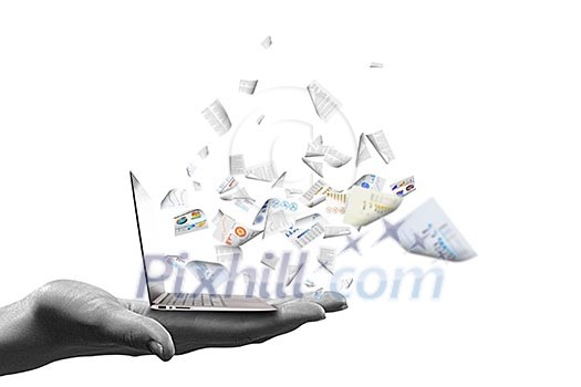 Close up of hand with laptop and media icons Close up of hand with laptop and media icons