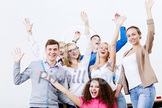 Young happy people in classroom screaming joyfully