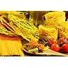 Cherry tomatoes and vegetables on kitchen table