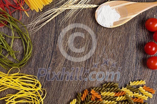 Cherry tomatoes and vegetables on kitchen table