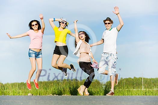 Young happy people having fun outside in summer