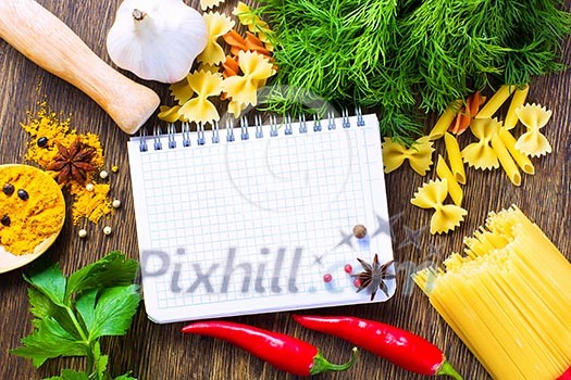 Chilli pepper macaroni herbs and splices on kitchen table