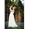Lovely bride outdoors in a forest