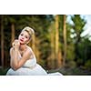 Lovely bride outdoors in a forest